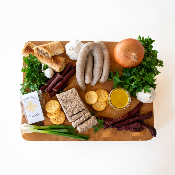 Handcrafted Cajun gift box from Bourgeois Meat Market, featuring premium smoked meats, boudin, and authentic Louisiana flavors—perfect for holidays, birthdays, and corporate gifts.