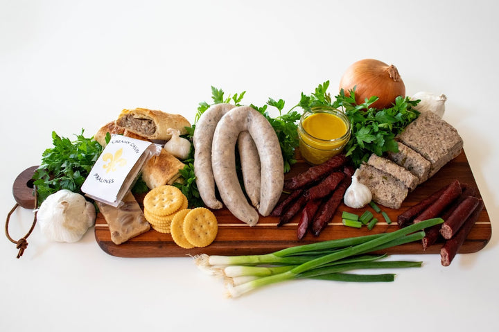 Handcrafted Cajun gift box from Bourgeois Meat Market, featuring premium smoked meats, boudin, and authentic Louisiana flavors—perfect for holidays, birthdays, and corporate gifts.