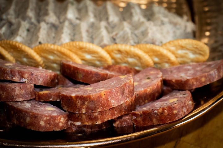 Handcrafted Cajun wood-smoked summer sausage from Bourgeois Meat Market—bold, savory flavor perfect for charcuterie boards, road trips, and protein-packed snacks.