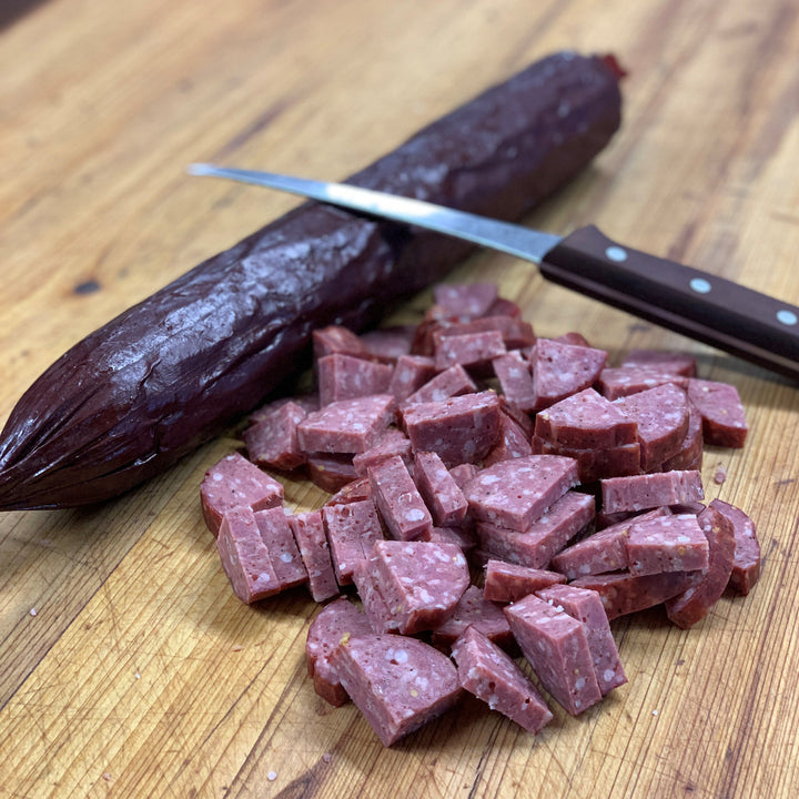 Handcrafted Cajun wood-smoked summer sausage from Bourgeois Meat Market—bold, savory flavor perfect for charcuterie boards, road trips, and protein-packed snacks.