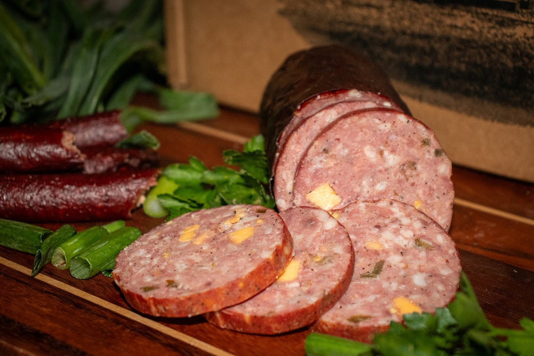 Premium smoked meats gift box from Bourgeois Meat Market, packed with Cajun wood-smoked sausage, summer sausage, and jerky—perfect for meat lovers.