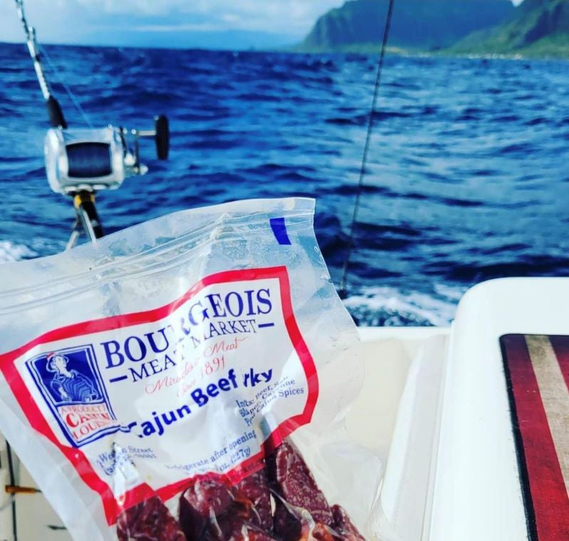 Premium cajun beef jerky from Bourgeois Meat Market— wood smoked, high-protein, low-sugar snack perfect for road trips, outdoor adventures, and fitness enthusiasts across the USA.