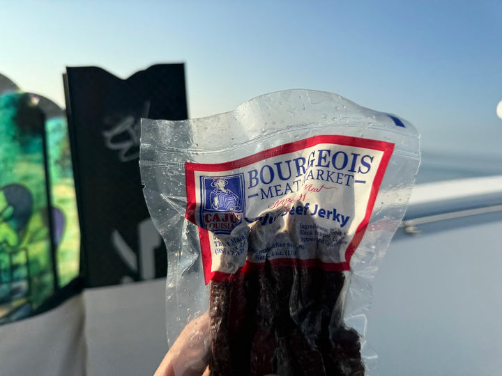 Premium cajun beef jerky from Bourgeois Meat Market— wood smoked, high-protein, low-sugar snack perfect for road trips, outdoor adventures, and fitness enthusiasts across the USA.