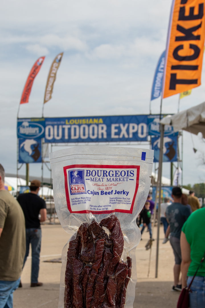 Premium cajun beef jerky from Bourgeois Meat Market— wood smoked, high-protein, low-sugar snack perfect for road trips, outdoor adventures, and fitness enthusiasts across the USA.